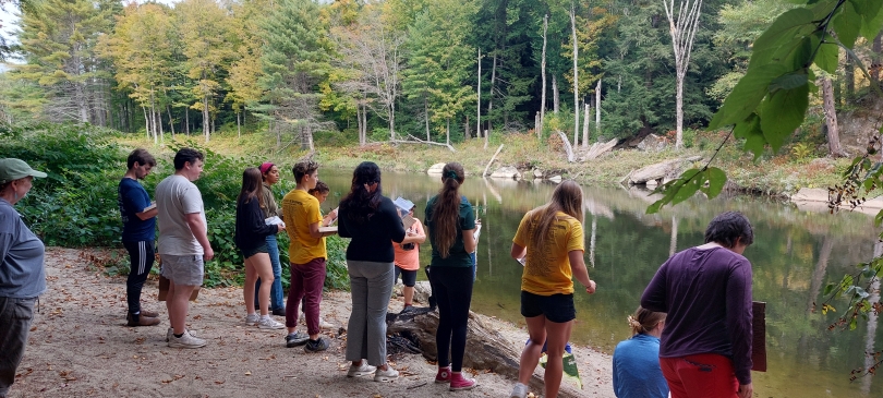 Students at a watering hole during a class lesson